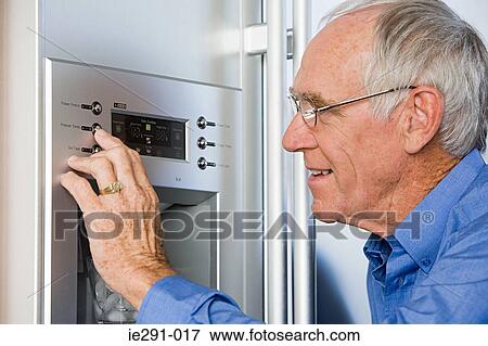 Man using refrigerator View Large Photo Image Stock Photo - Man using refrigerator. Fotosearch