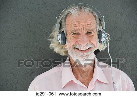 Stock Image - Man with telephone headset. Fotosearch