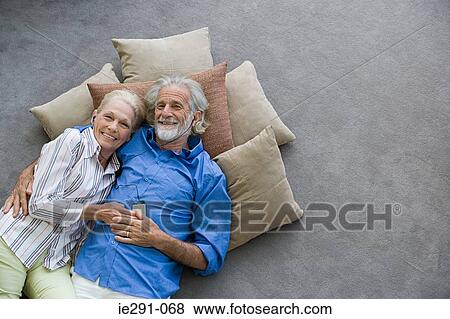 Senior couple listening to mp3 player View Large Photo Image Stock Photo - Senior couple listening to mp3 player. Fotosearch