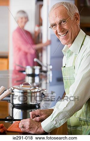 Senior man cooking View Large Photo Image Stock Photo - Senior man cooking. Fotosearch