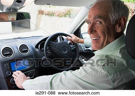 Senior man driving car View Large Photo Image Stock Photo - Senior man driving car. Fotosearch