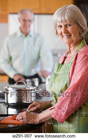 Senior woman cooking View Large Photo Image Stock Photo - Senior woman cooking. Fotosearch