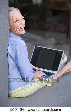 Picture - Senior woman with laptop. Fotosearch