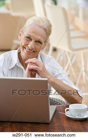 Senior woman with laptop View Large Photo Image Stock Image - Senior woman with laptop. Fotosearch
