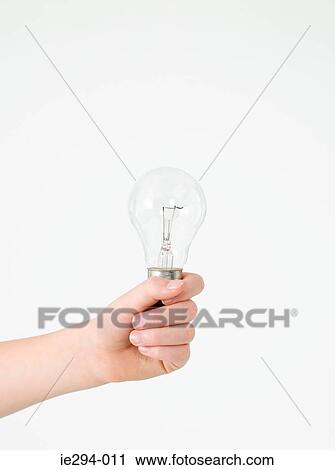 Child holding a lightbulb View Large Photo Image Stock Image - Child holding a lightbulb. Fotosearch