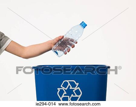 Child recycling a bottle View Large Photo Image Picture - Child recycling a bottle. Fotosearch