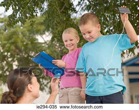 Children holding solar panels View Large Photo Image Stock Photography - Children holding solar panels. Fotosearch
