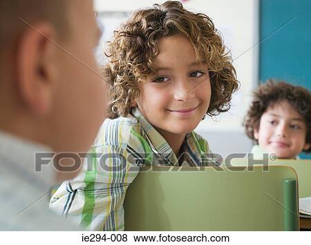 Children sat in a lesson View Large Photo Image Stock Photo - Children sat in a lesson. Fotosearch