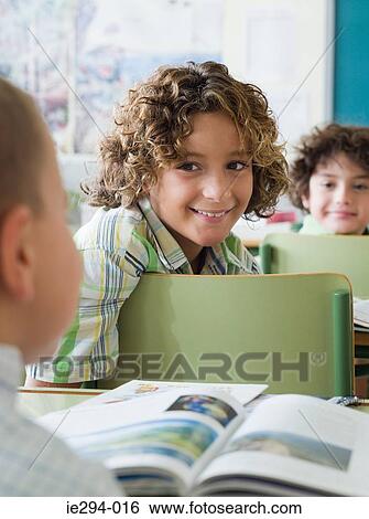 Children sat in a lesson View Large Photo Image Stock Photograph - Children sat in a lesson. Fotosearch