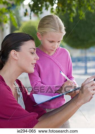 Teacher and pupil outdoors View Large Photo Image Stock Photography - Teacher and pupil outdoors. Fotosearch