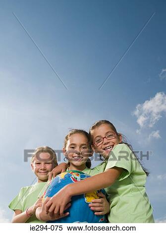Three girls with inflatable earth View Large Photo Image Stock Photography - Three girls with inflatable earth. Fotosearch