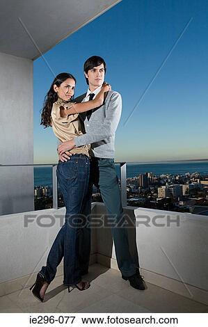 Couple on balcony View Large Photo Image Stock Photo - Couple on balcony. Fotosearch