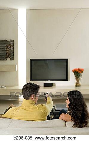 Stock Photography - Couple watching television. Fotosearch