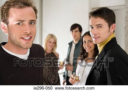 Friends at a party View Large Photo Image Stock Image - Friends at a party. Fotosearch