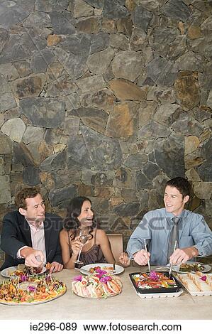 Stock Photo - Friends at a party. Fotosearch