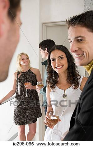 Friends at a party View Large Photo Image Stock Photography - Friends at a party. Fotosearch