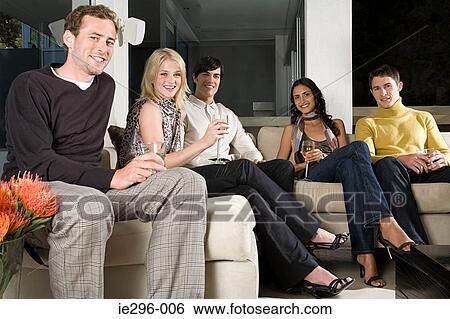 Friends on sofa View Large Photo Image Stock Photograph - Friends on sofa. Fotosearch