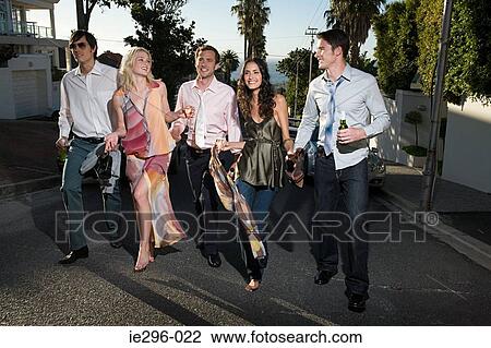Stock Image - Friends walking from party. Fotosearch