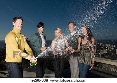 Man spraying champagne View Large Photo Image Stock Photo - Man spraying champagne. Fotosearch