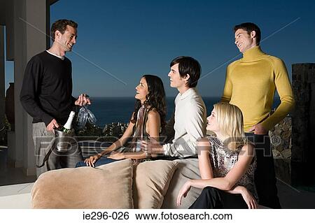 Man with champagne for friends View Large Photo Image Stock Photograph - Man with champagne for friends. Fotosearch