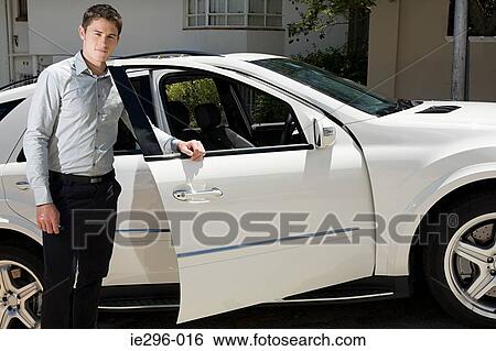 Stock Photograph - Young man and car. Fotosearch
