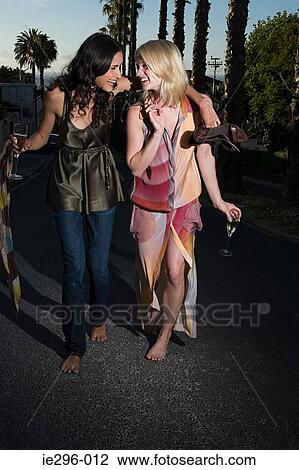 Young women walking from party View Large Photo Image Stock Image - Young women walking from party. Fotosearch