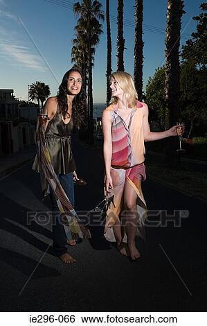 Young women walking from party View Large Photo Image Stock Photograph - Young women walking from party. Fotosearch