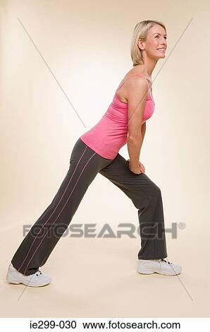 A woman doing lunges View Large Photo Image Stock Image - A woman doing lunges. Fotosearch