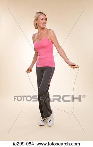 A woman skipping View Large Photo Image Picture - A woman skipping. Fotosearch