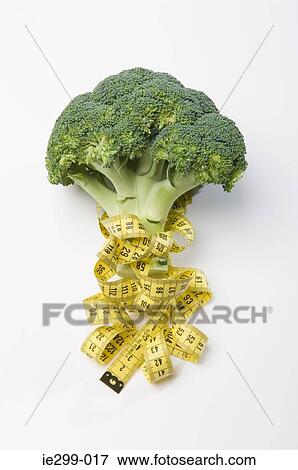 Broccoli and a tape measure View Large Photo Image Stock Photo - Broccoli and a tape measure. Fotosearch