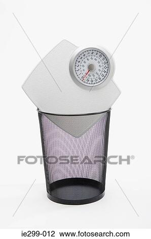 Scales in a wastepaper basket View Large Photo Image Stock Image - Scales in a wastepaper basket. Fotosearch