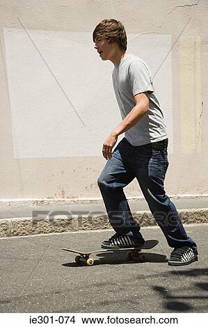 A teenage boy skateboarding View Large Photo Image Picture - A teenage boy skateboarding. Fotosearch