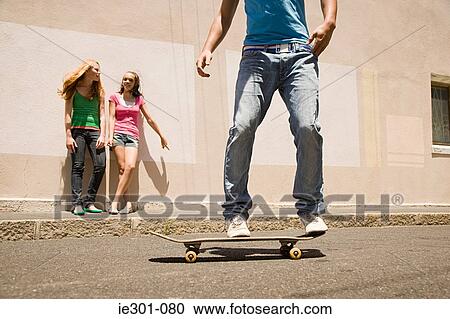 Stock Image - A teenage boy skateboarding. Fotosearch