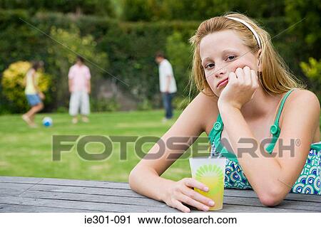 Stock Image - Portrait of a bored teenage girl. Fotosearch