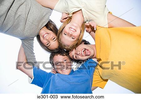 Portrait of teenagers in a huddle View Large Photo Image Stock Image - Portrait of teenagers in a huddle. Fotosearch
