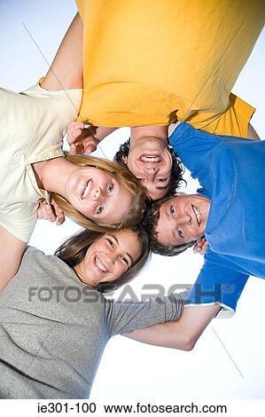 Portrait of teenagers in a huddle View Large Photo Image Stock Image - Portrait of teenagers in a huddle. Fotosearch