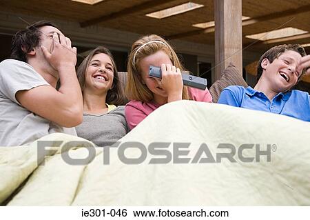 Teenage friends laughing View Large Photo Image Stock Photograph - Teenage friends laughing. Fotosearch
