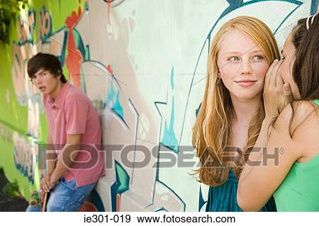 Teenage girls gossiping View Large Photo Image Stock Photo - Teenage girls gossiping. Fotosearch