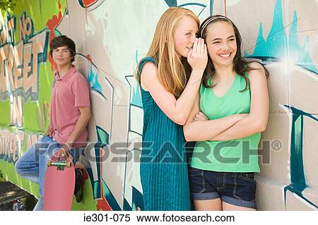 Teenage girls gossiping View Large Photo Image Stock Photography - Teenage girls gossiping. Fotosearch