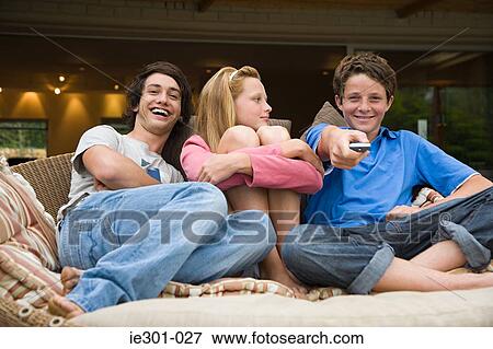 Teenagers watching tv View Large Photo Image Stock Photo - Teenagers watching tv. Fotosearch