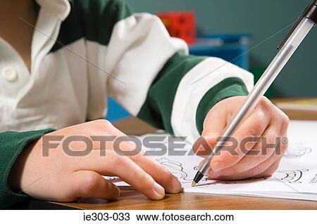 A boy writing View Large Photo Image Stock Image - A boy writing. Fotosearch