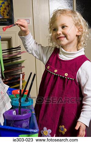 A girl painting View Large Photo Image Stock Image - A girl painting. Fotosearch