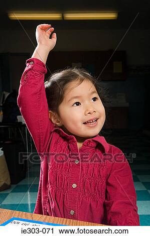 A girl with his arm raised View Large Photo Image Stock Image - A girl with his arm raised. Fotosearch