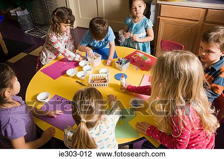 Stock Image - Children in a craft lesson. Fotosearch