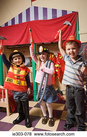 Children pretending to be firefighters View Large Photo Image Stock Photo - Children pretending to be firefighters. Fotosearch