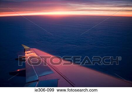 Stock Photo - Airplanes wing in flight. Fotosearch