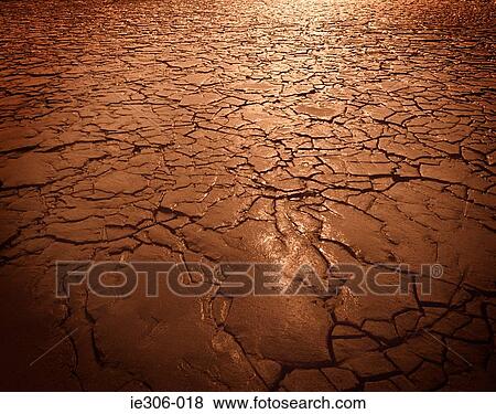 Cracked soil in drought View Large Photo Image Stock Photo - Cracked soil in drought. Fotosearch