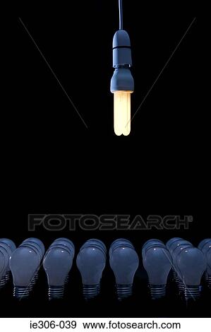 Energy saving lightbulb above other bulbs View Large Photo Image Stock Photo - Energy saving lightbulb above other bulbs. Fotosearch