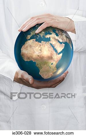 Scientist holding a globe View Large Photo Image Stock Photo - Scientist holding a globe. Fotosearch