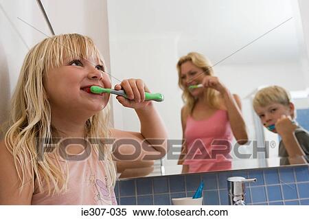 A family brushing their teeth View Large Photo Image Stock Photography - A family brushing their teeth. Fotosearch